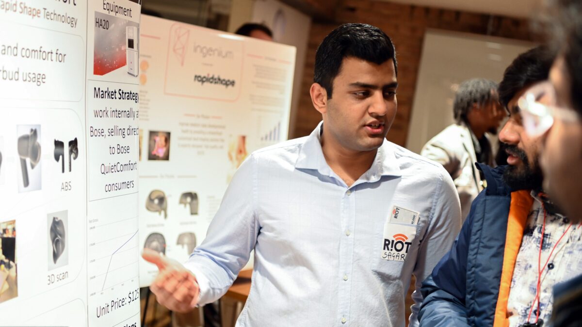 Sagar Rijhwani talking with the judges