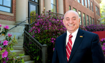 Louis Martin-Vega is standing outside of Page Hall on NC State's Main Campus.